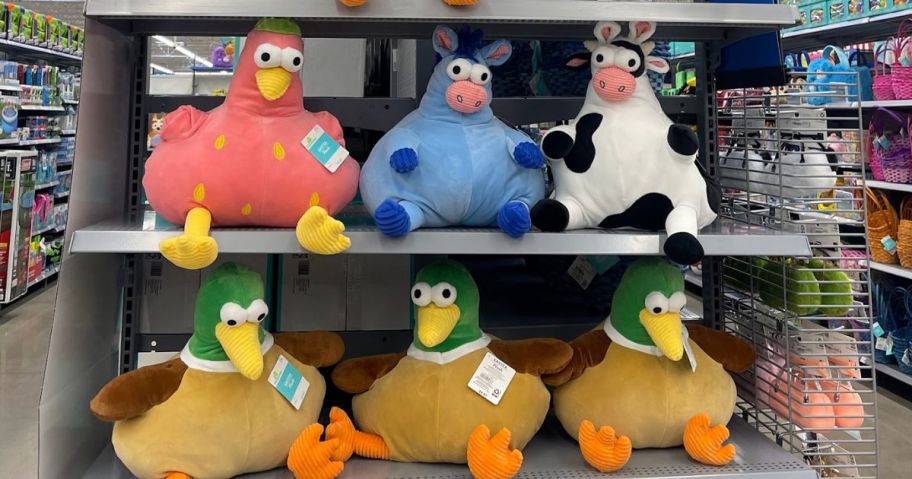 Plush farm animals on a shelf in Walmart