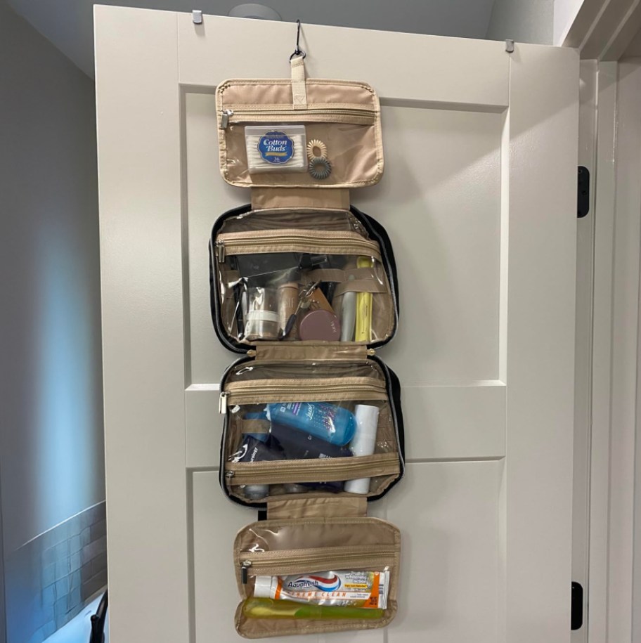 toiletry bag hanging on bathroom door