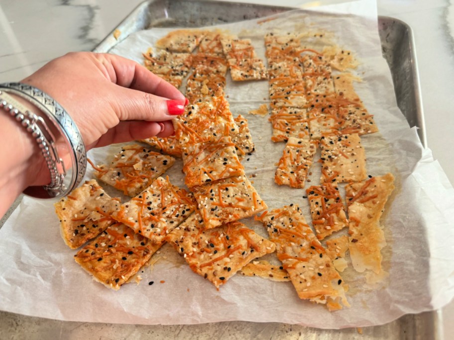 breaking apart sourdough crackers