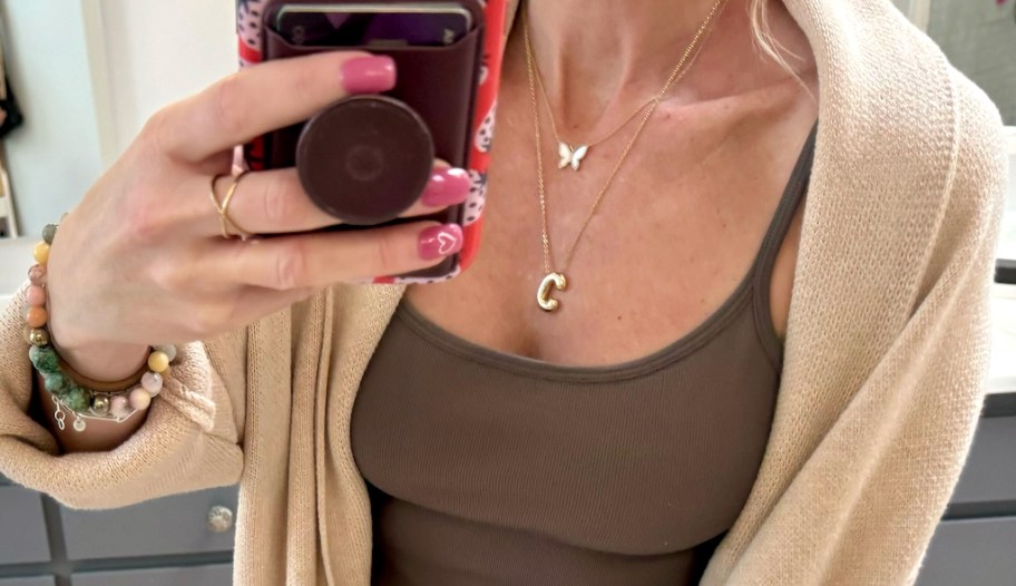 woman taking a selfie wearing a bubble necklace