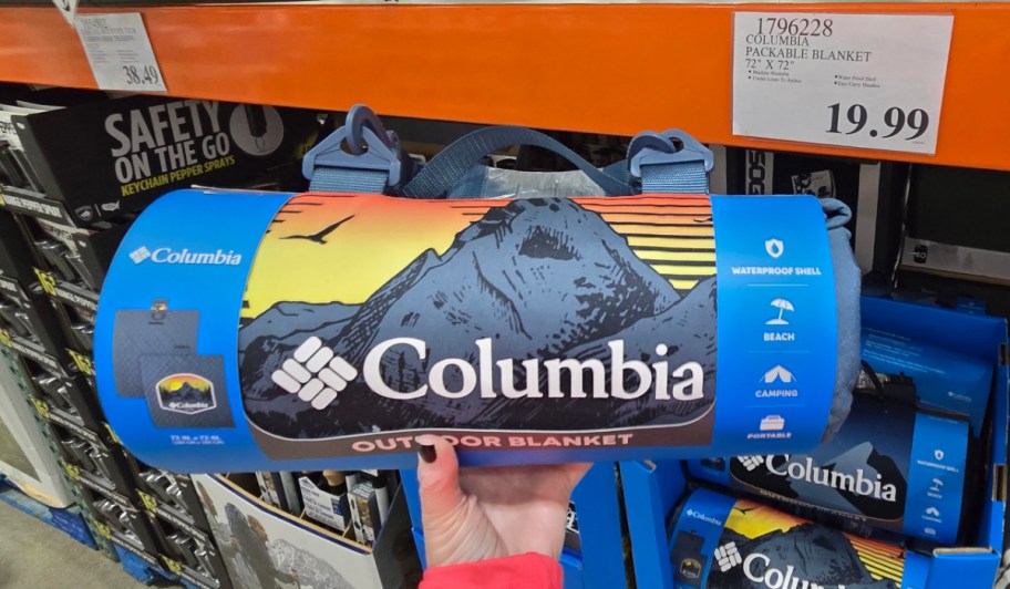 hand holding columbia blanket in store