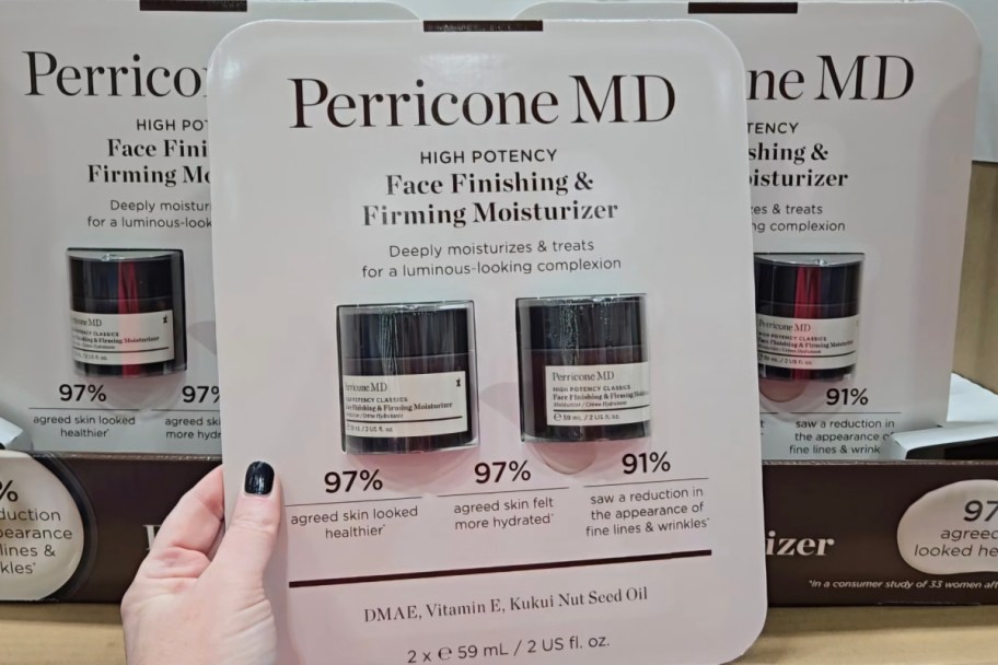 hand holding perricone md moisturizers