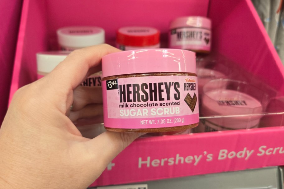 hand holding milk chocolate body scrub in store