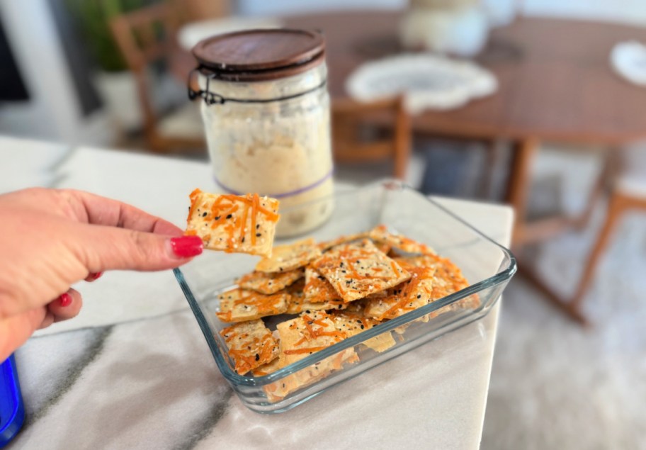 holding a sourdough cracker 