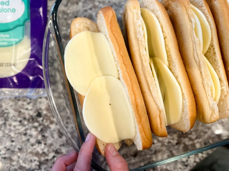 putting sliced cheese on bread