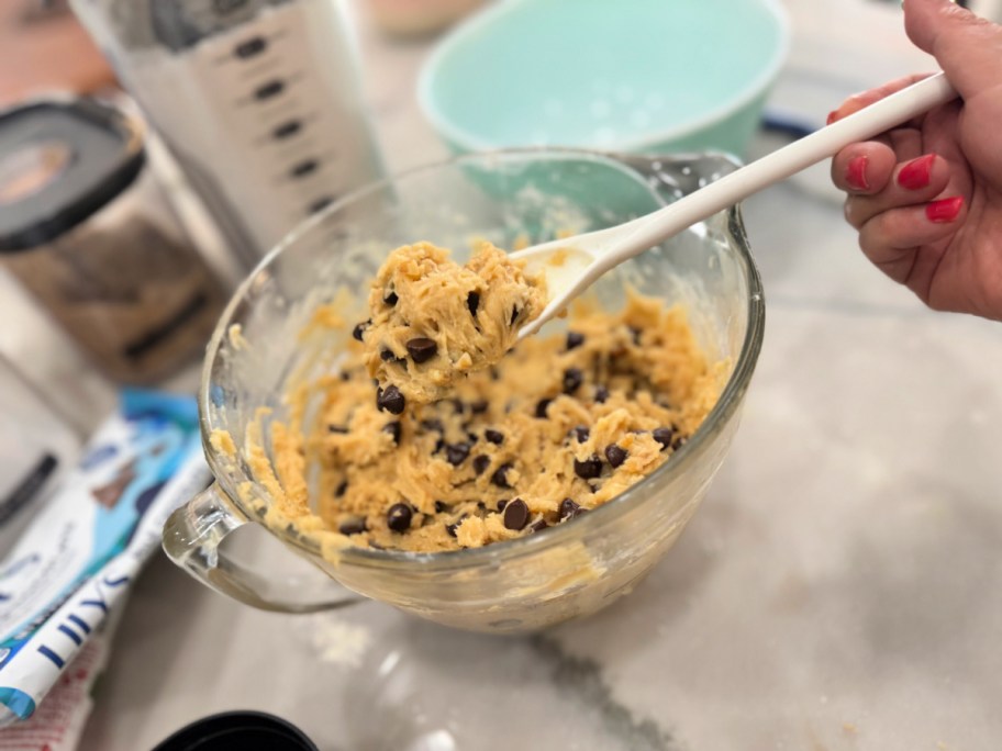 mixing cookie dough in a mixing bowl