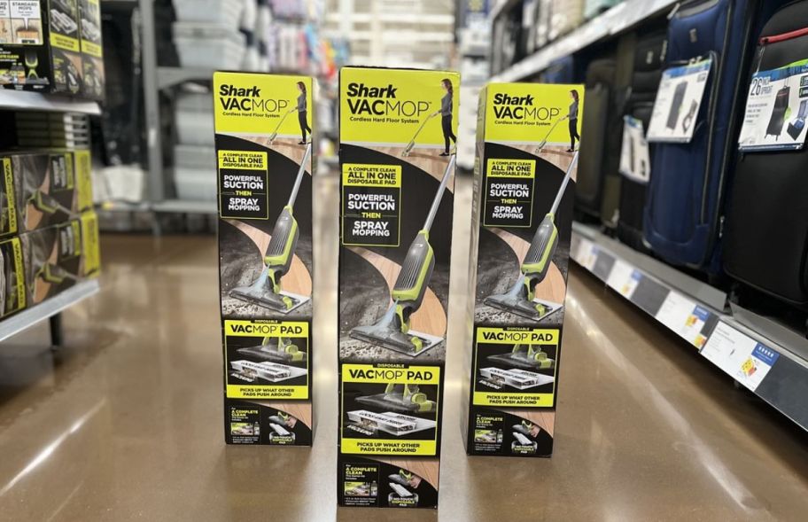 three shark vac mop boxes on a store aisle