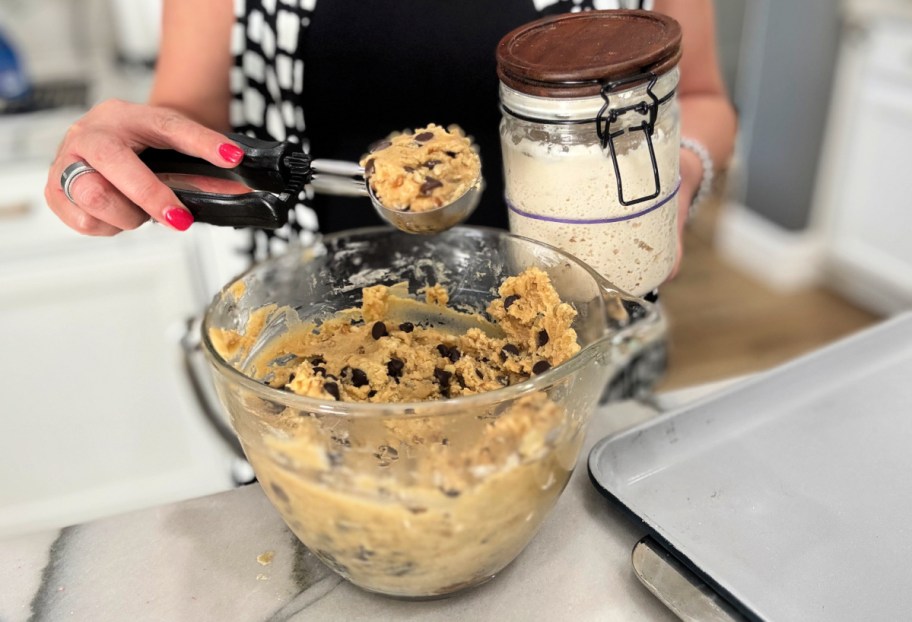 sourdough starter next to a bowl of cookie dough