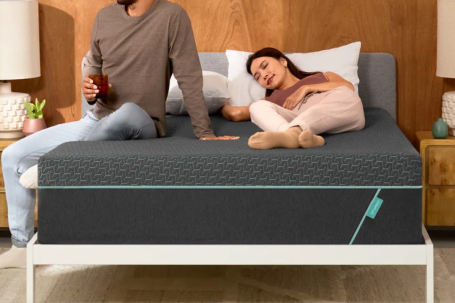 couple on dark grey hybrid mattress