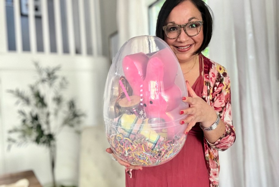 woman holding a clear jumbo easter egg basket