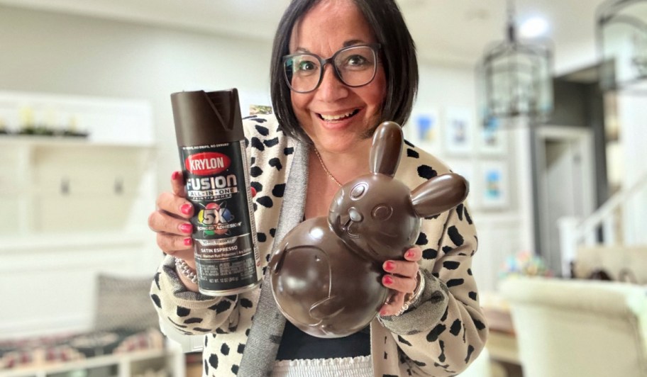 woman holding spray painted chocolate easter bunny 