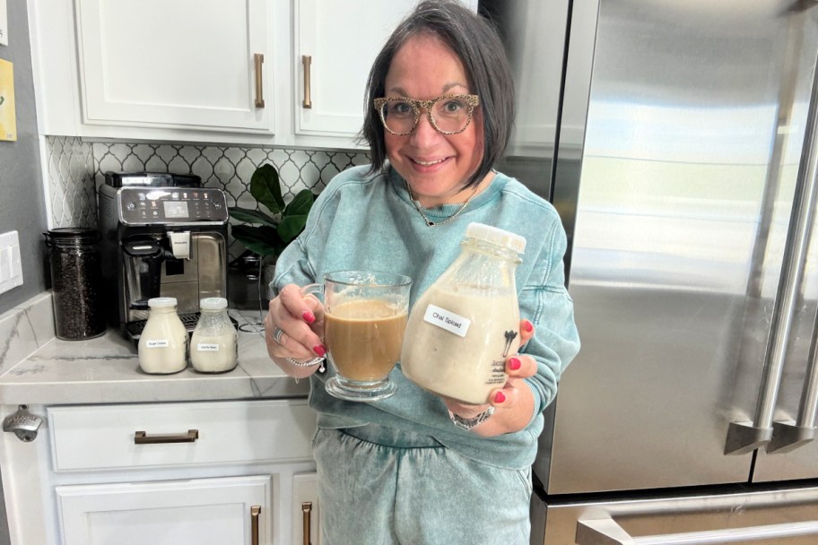 woman holding up coffee with homemade creamer