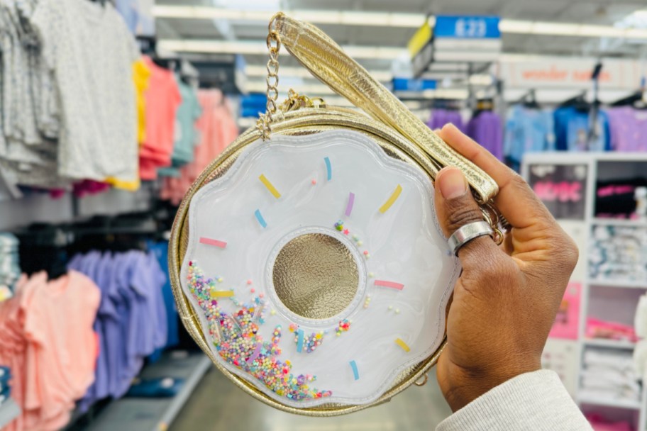 hand holding donut purse in store