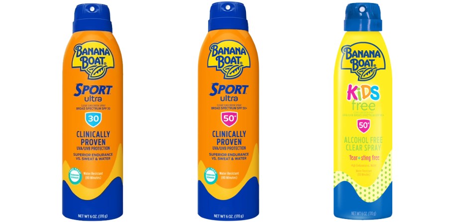 three orange and yellow bottles of Banana Boat sunscreen sprays