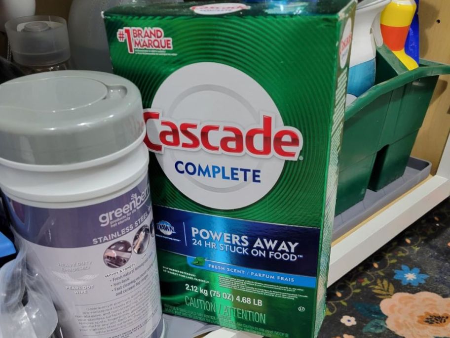 a box of Cascade Powder Detergent on a kitchen shelf