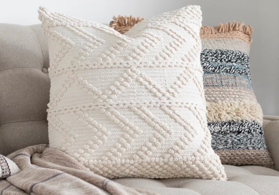 white pillow on gray sofa