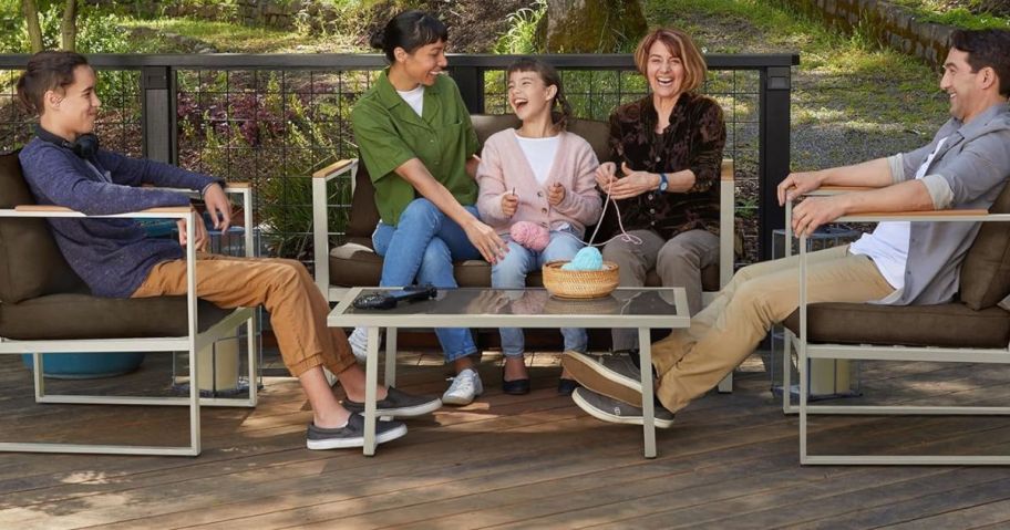 A family gathered outside on their patio