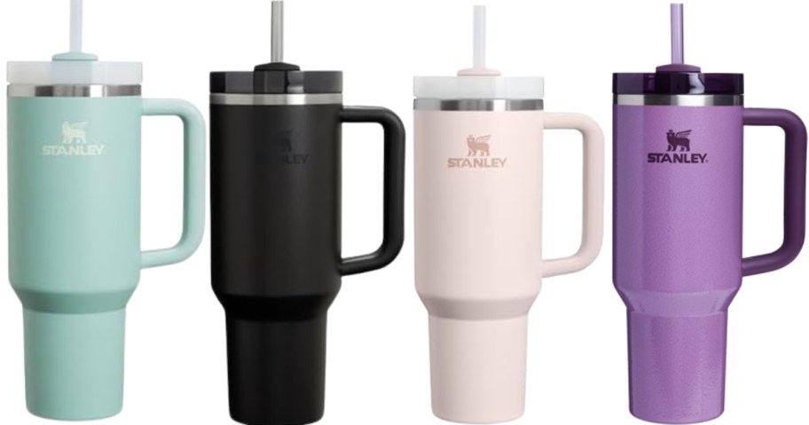 four Stanley tumblers in different colors
