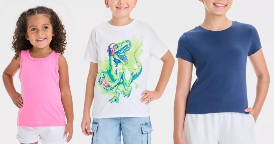 little girl wearing a pink tank top, boy wearing a white tee with a dinosaur on it and girl wearing a blue tshirt