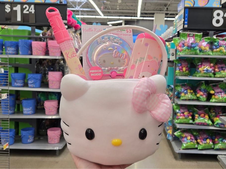 A person holding a Hello Kitty Easter Basket filled with fun treats and toys at Walmart