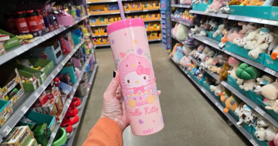 A person holding a Hello Kitty Easter Water Bottle at Walmart