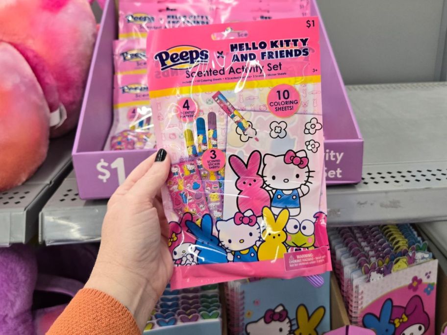 A person holding a Hello Kitty x Peeps Easter Scented Activity Set at Walmart