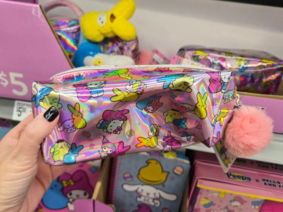 A person holding a Hello Kitty x Peeps EasterPencil Case at Walmart