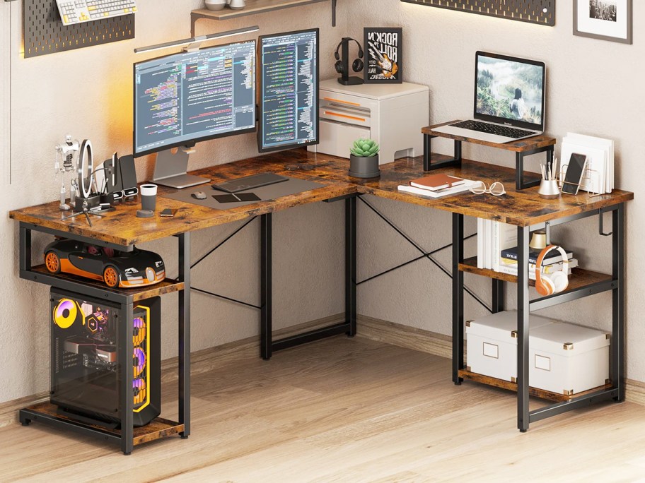 wood and metal l-shaped desk with multiple monitors on top 