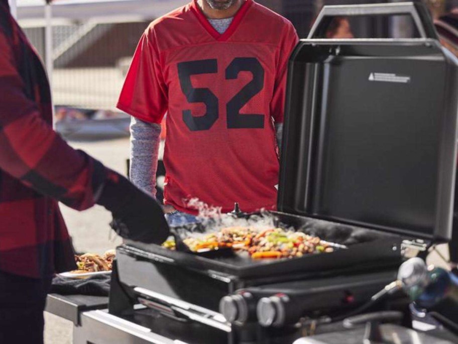Men grilling on the 2-Burner 22Flat Top Grill