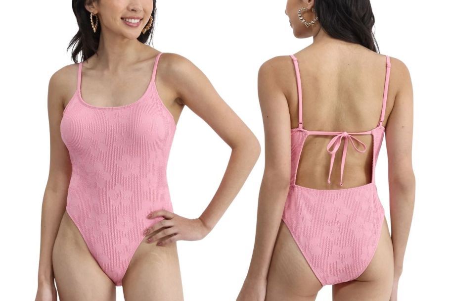 a model in pink 1 piece swimsuit