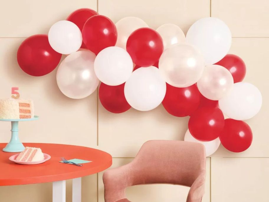 Spritz Target Red & White Balloon Arch Garland on wall