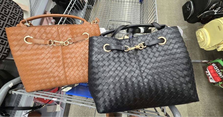 A brown and a black purse in a Walmart shopping cart