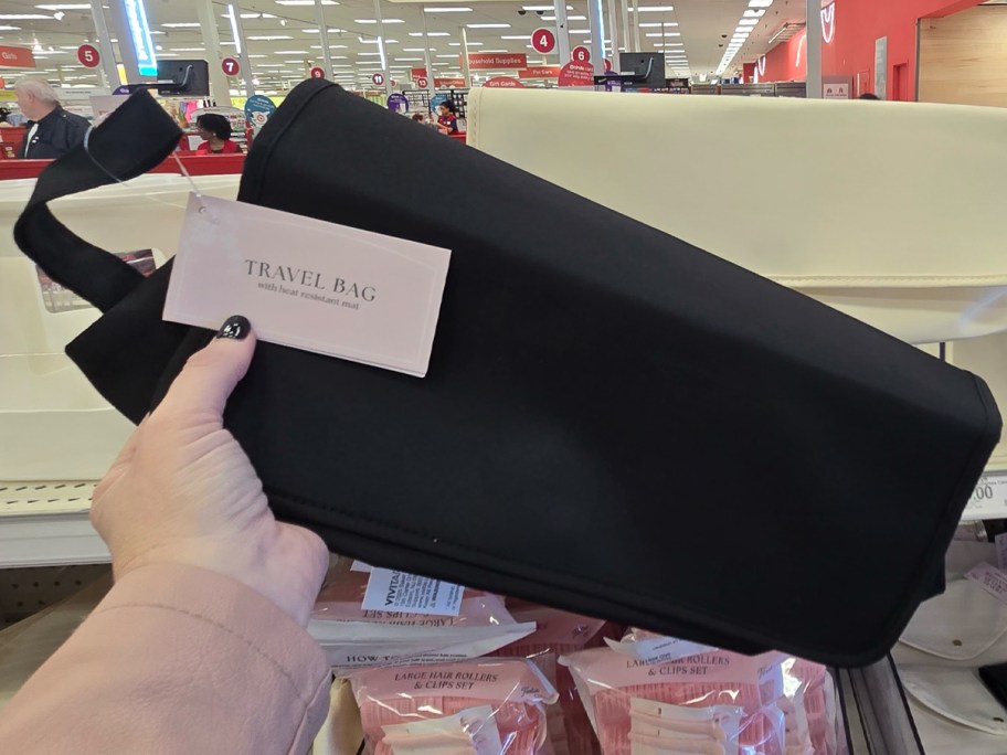 woman holding Travel Bag in Target