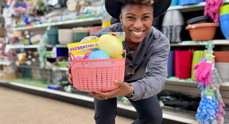 Woman holding a basket filled with Easter savings inside at a store aisle
