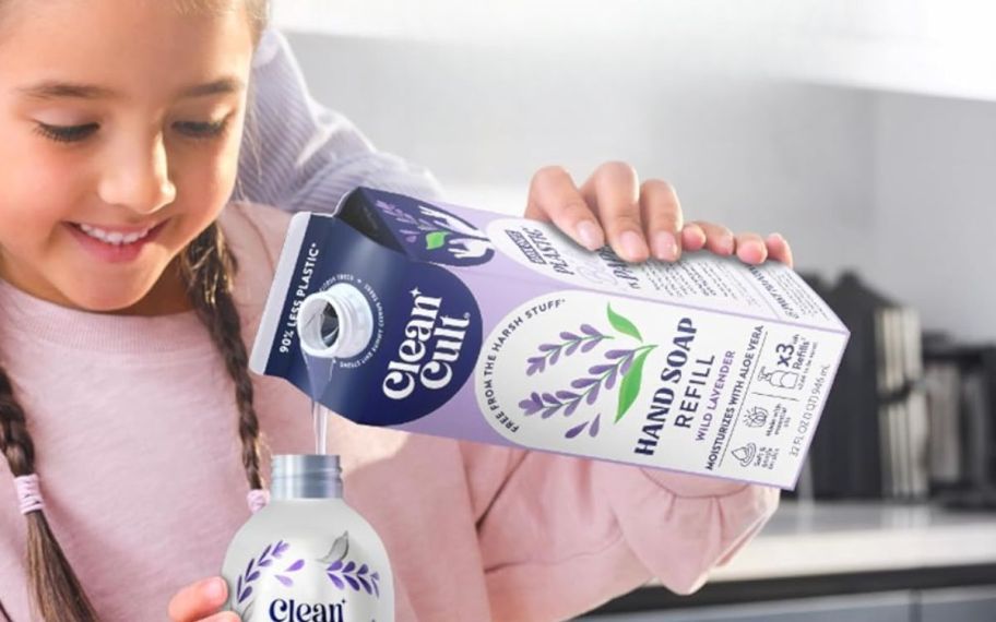 a little girl refilling a hand soap dispenser bottle
