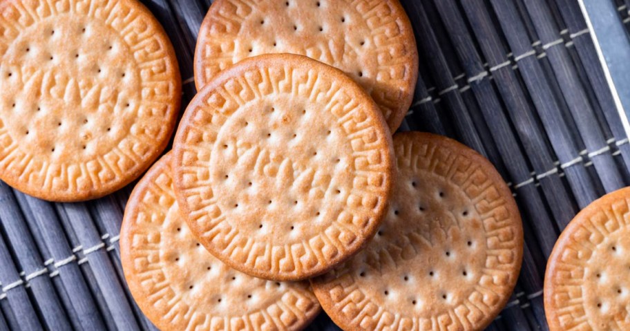 various thin round cookies on placemat