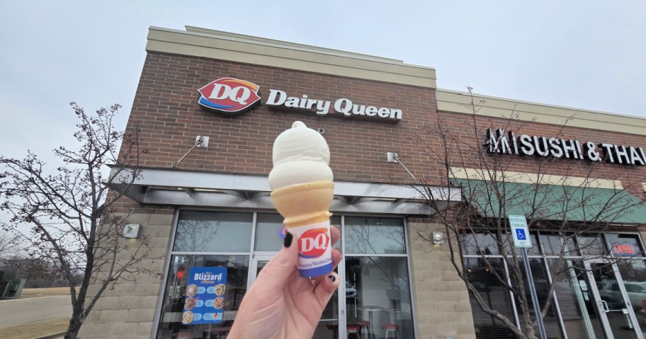 person holding a dairy queen ice cream cone