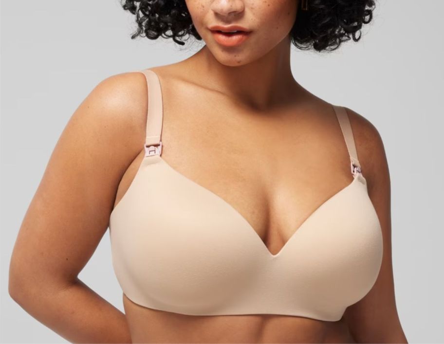 woman in a beige colored wireless nursing bra