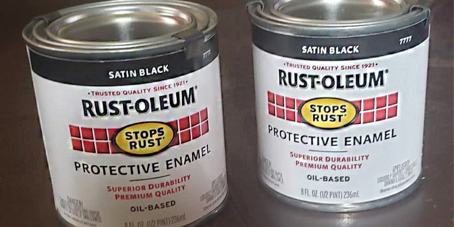 two black rustoleum paint cans 