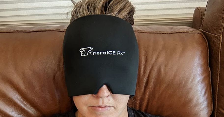 woman sitting on couch and wearing TheraICE Migraine Relief Cap