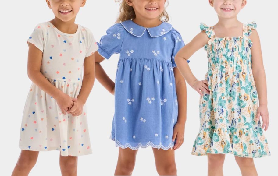 3 little girls wearing spring dresses