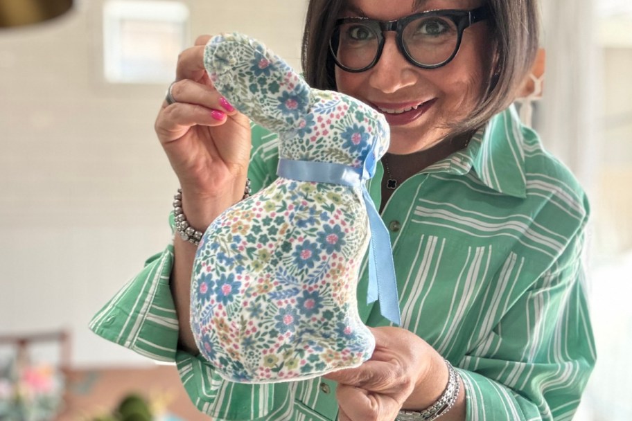 woman holding blue floral bunny