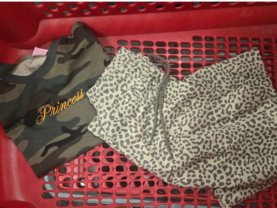 woman princess shirt and women leopard pants displayed in target cart