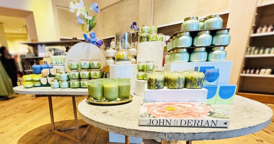 display tables full of candles in Anthropologie store