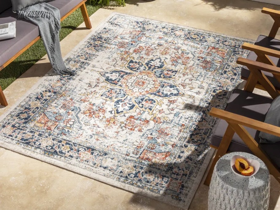 colorful oriental rug on patio
