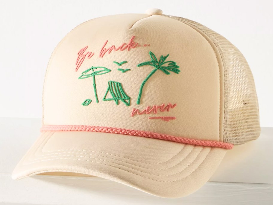 white and pink trucker hat that says be back never