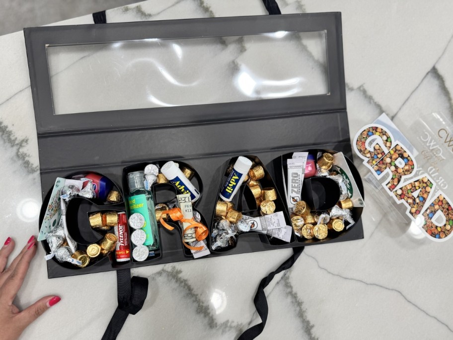 cook with color grad snackle box filled with candy and supplies