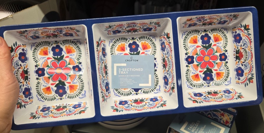 hand holding dinnerware tray