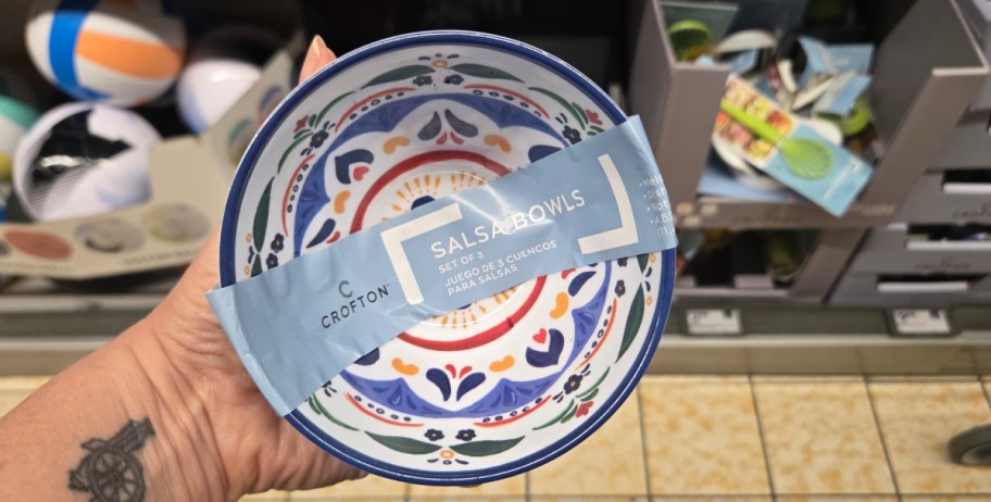 hand holding salsa bowl