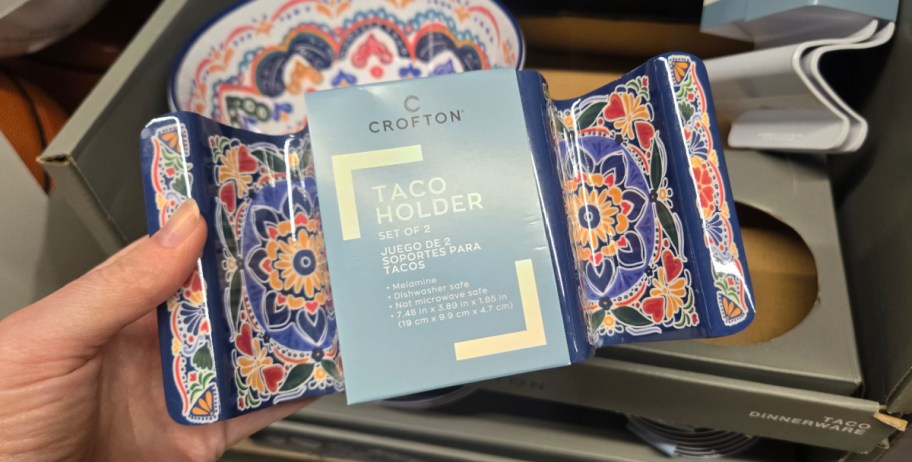 Hand holding taco holder with a nice design